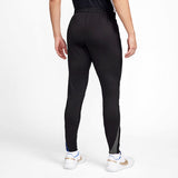 Back view of black Nike Barcelona training tracksuit pants worn with white sneakers