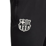 Close-up of Nike Barcelona training tracksuit black pants with FCB club logo patch