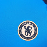 Close-up of Chelsea FC logo on blue fabric of Chelsea FC 2024 training tracksuit from SoccerTracksuits.com