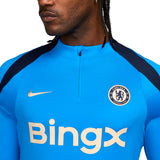 Close-up of Chelsea FC 2024 training tracksuit top with Nike logo and Bingx sponsor in blue and black