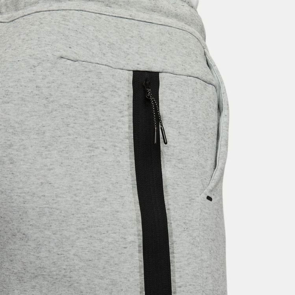 Close-up of grey Chelsea FC tech fleece tracksuit grey pants with black zippered pocket detail