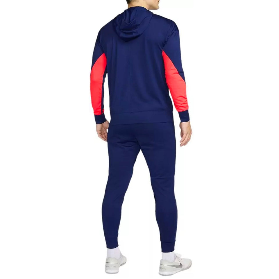 Back view of man wearing Croatia soccer tracksuit 2024 25 in navy blue with red sleeves and hood