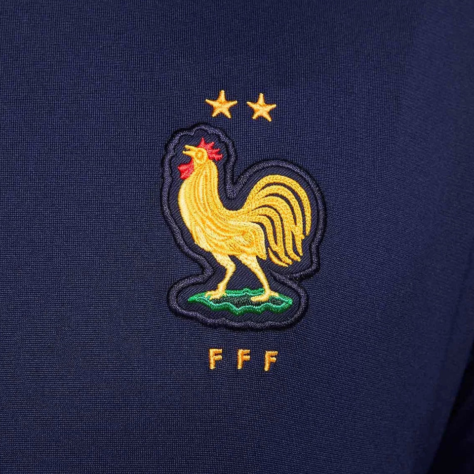 France soccer tracksuit 2024 featuring embroidered golden rooster emblem on navy fabric