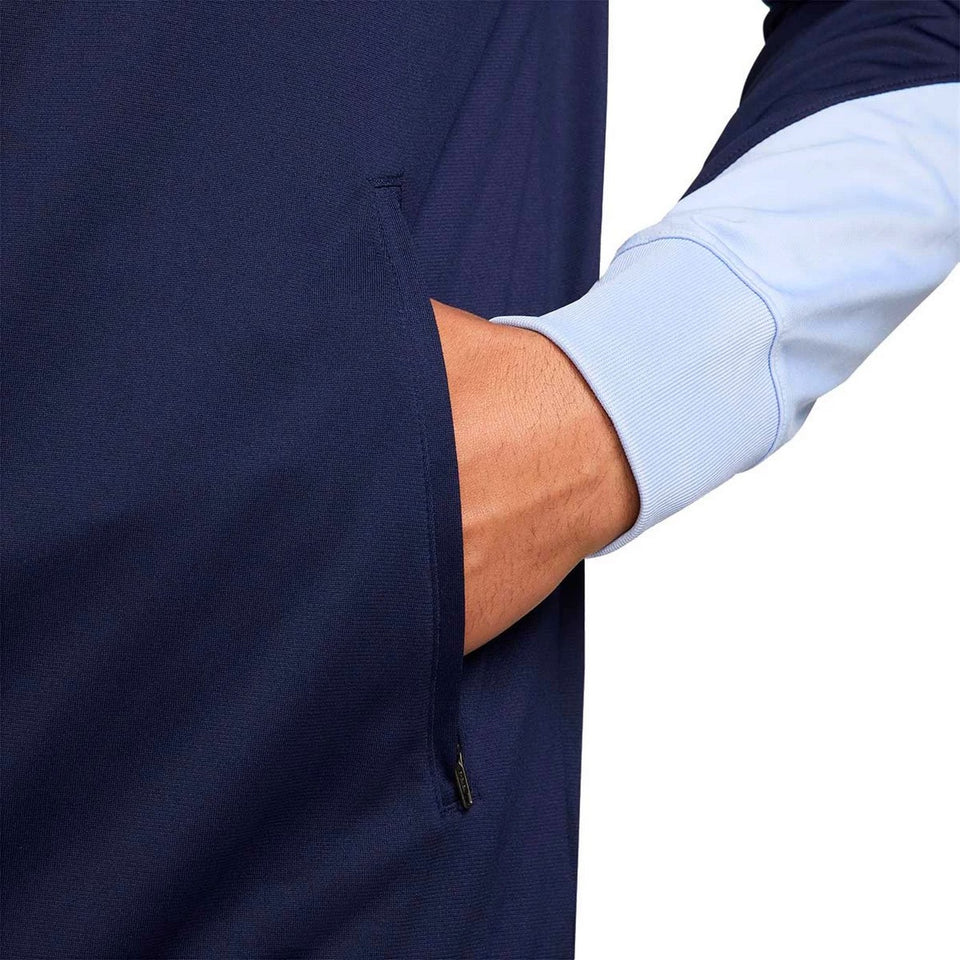 Close-up of hand in pocket on navy and light blue France soccer tracksuit 2024 on SoccerTracksuits.com