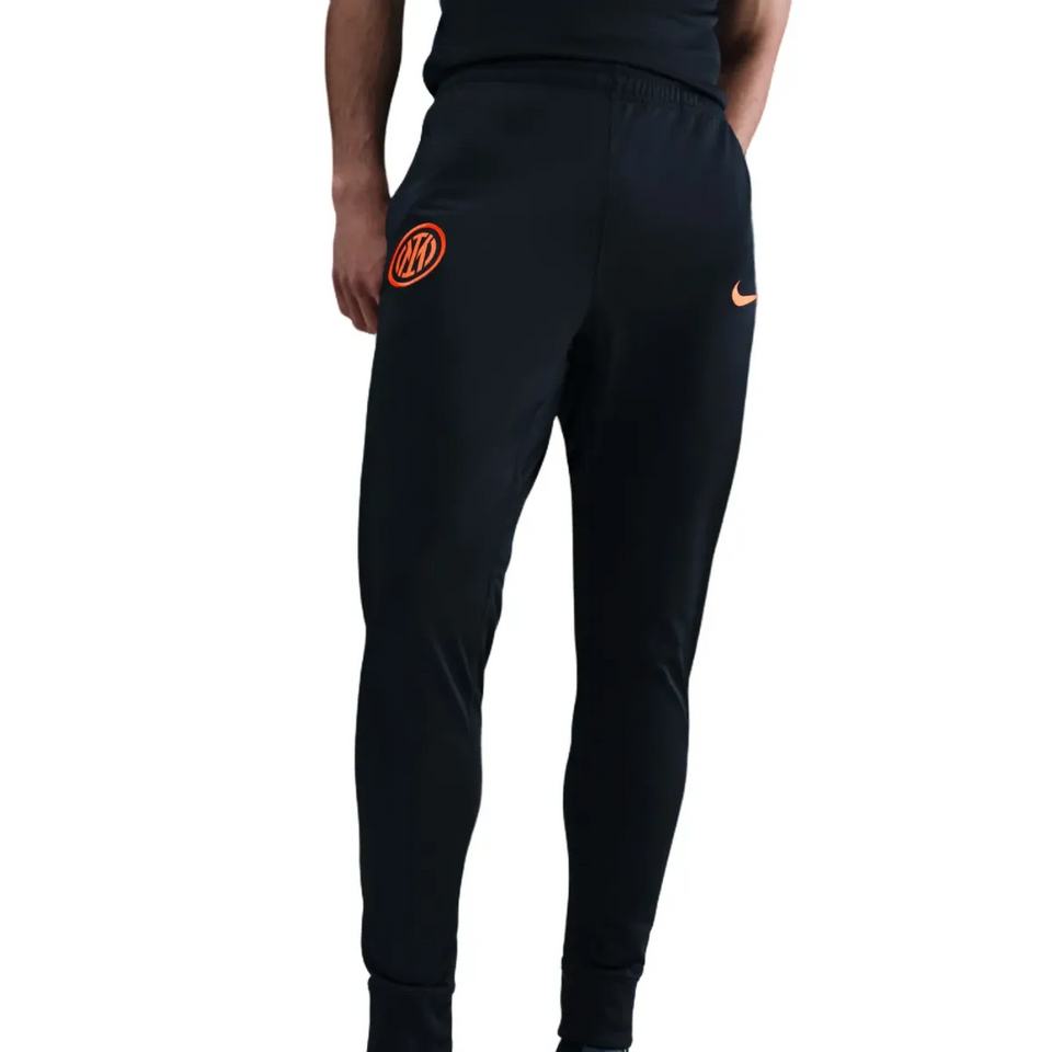 Inter Milan Nike UCL tracksuit 2025 26 featuring stylish black tapered pants with logo detail.