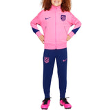 Kids Atletico Madrid tracksuit 2024 in pink and navy blue worn by child model on SoccerTracksuits.com