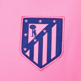 Close-up of Atletico Madrid logo on pink fabric of kids Atletico Madrid tracksuit 2024