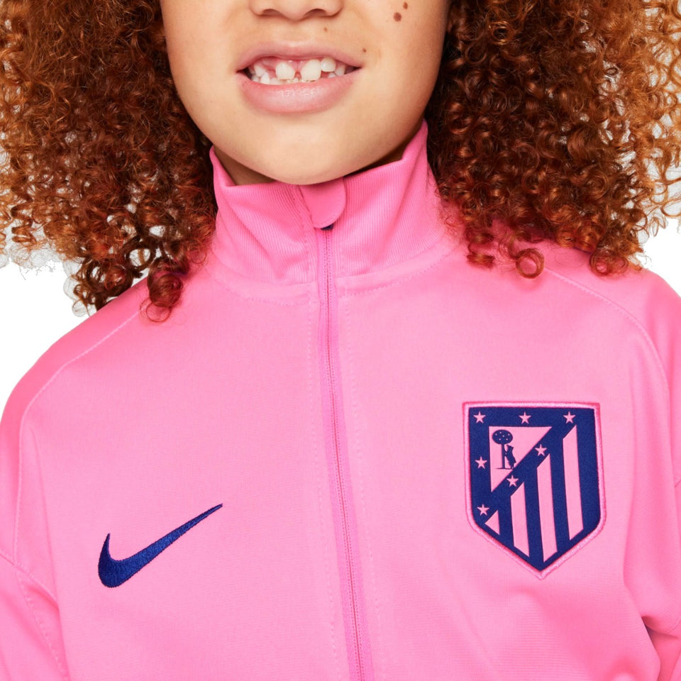 Kids Atletico Madrid tracksuit 2024 jacket in pink with Atletico Madrid crest and Nike logo