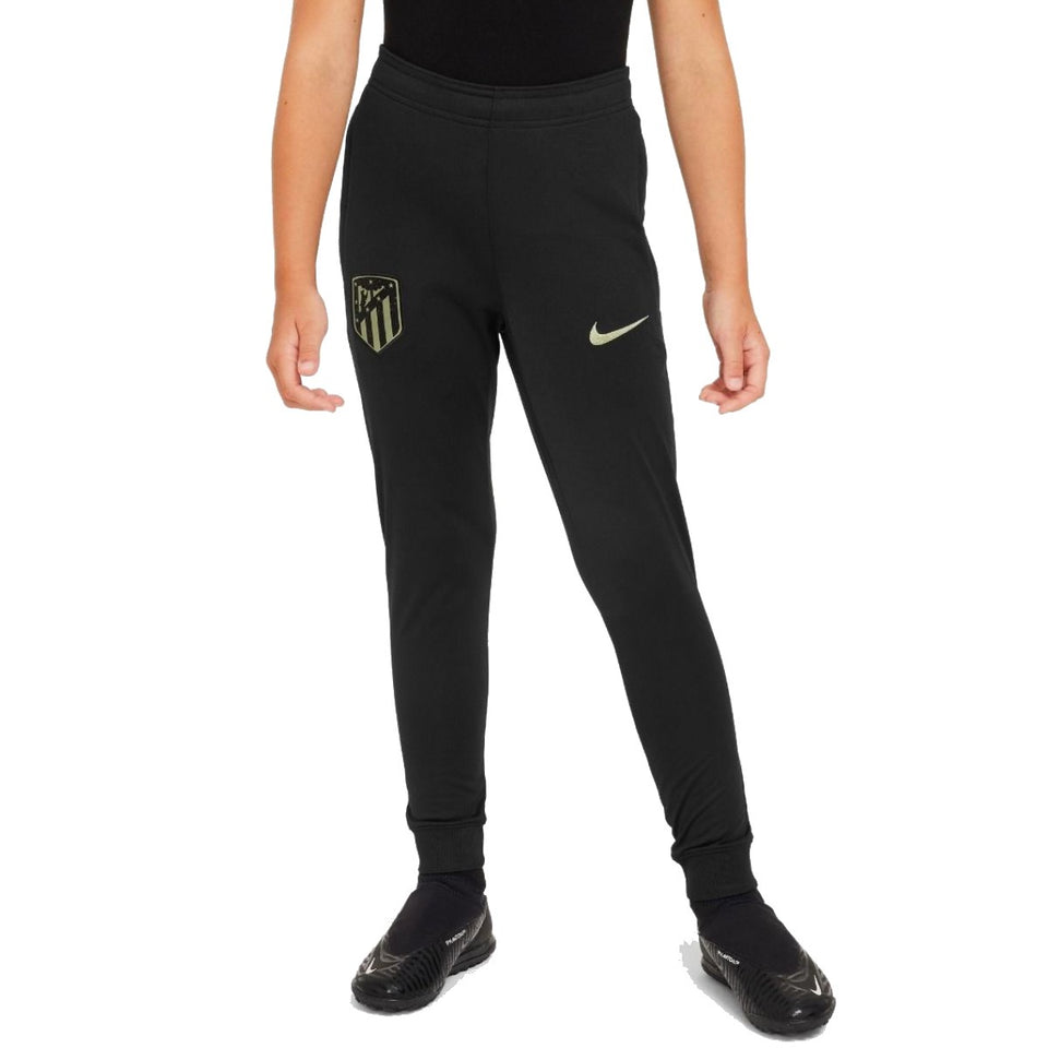 Kids Atletico Madrid tracksuit black pants with team logo and Nike swoosh on SoccerTracksuits.com
