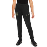 Kids Atletico Madrid tracksuit black pants with team logo and Nike swoosh on SoccerTracksuits.com