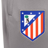 Close-up of Atletico Madrid crest on gray fabric of kids Atletico Madrid tracksuit by Soccer Tracksuits