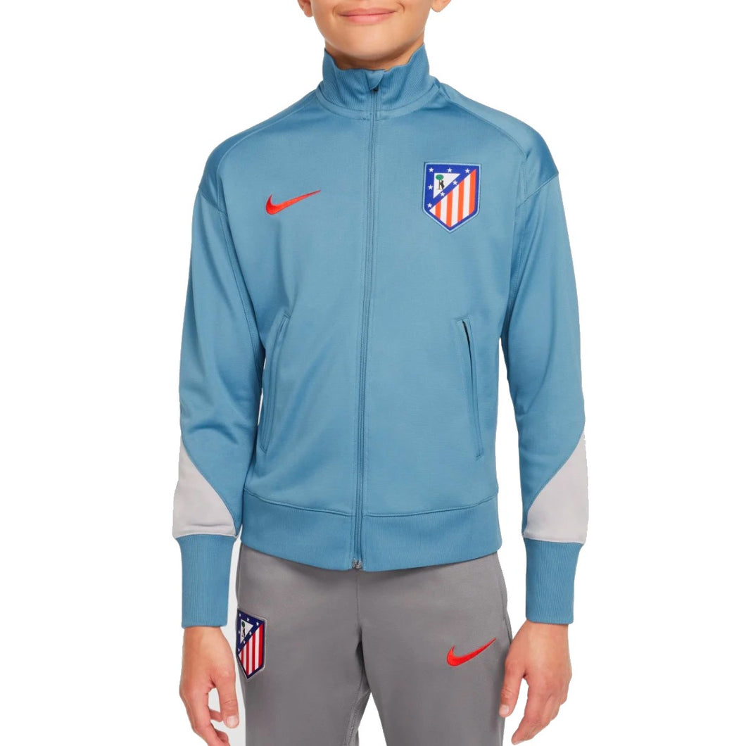 Kids Atletico Madrid tracksuit in blue and gray with red Nike logos by Soccer Tracksuits
