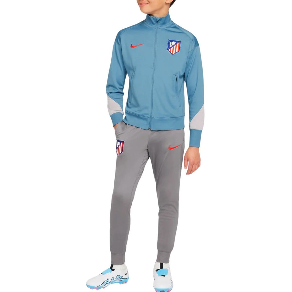 Kids Atletico Madrid tracksuit by Soccer Tracksuits in blue and gray with red logo accents
