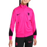 Kids Chelsea FC training tracksuit in bright pink with black accents and Nike logos
