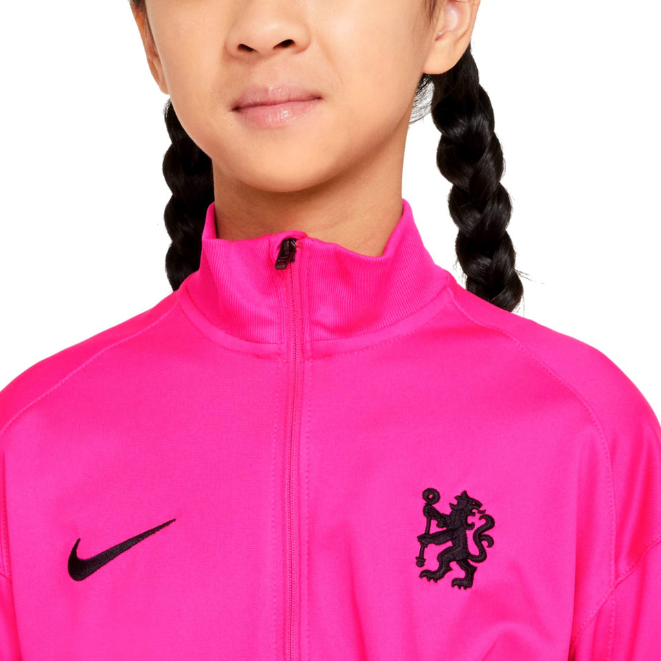 Close-up of a kids Chelsea FC training tracksuit jacket in bright pink with black Nike logo and club emblem