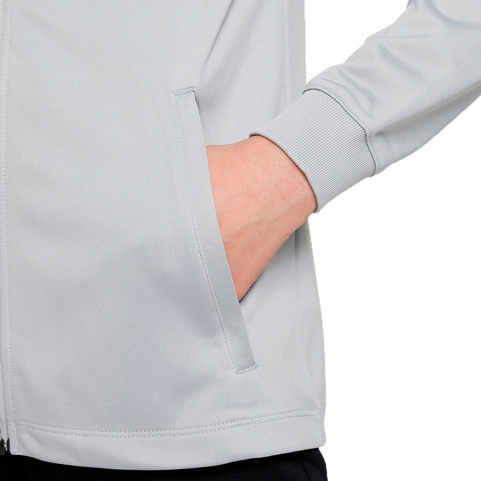 Close-up of hand in pocket on gray kids Liverpool soccer tracksuit jacket with ribbed cuff