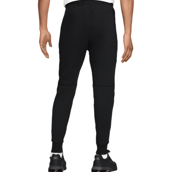 Liverpool FC black tech fleece pants back view on model tapered fit with ribbed cuffs and sneakers