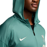 Close-up of green Liverpool FC presentation tracksuit 2024 25 hoodie with Nike logo and team crest