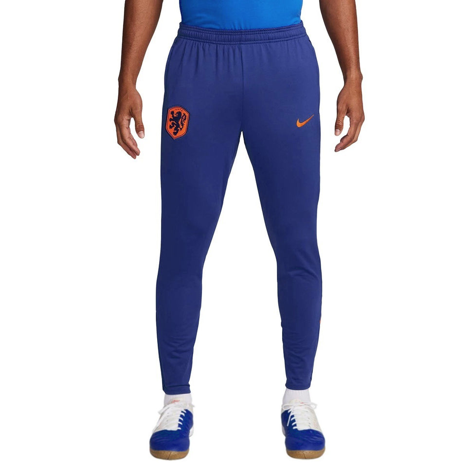 Blue Nike Netherlands training tracksuit pants with orange logo and Nike swoosh on SoccerTracksuits.com