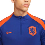 Close-up of Nike Netherlands training tracksuit top with orange accents and embroidered lion crest
