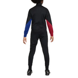 Back view of official kids Nike Barca tracksuit in black with blue and red sleeves for kids