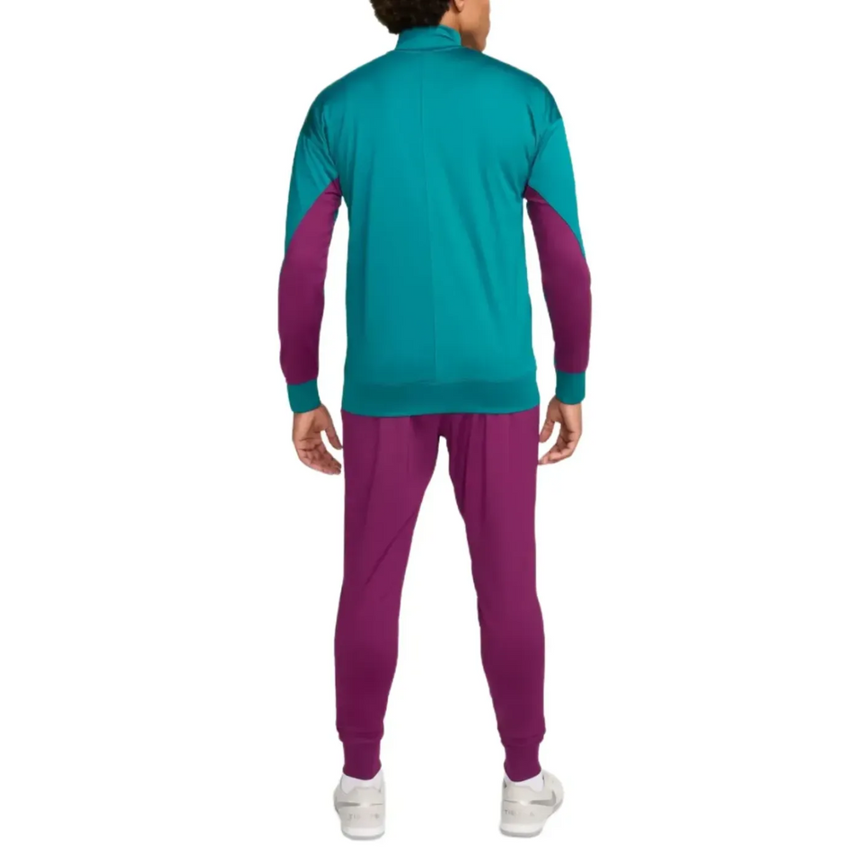Back view of official PSG Nike tracksuit 2024 in teal and purple with white sneakers
