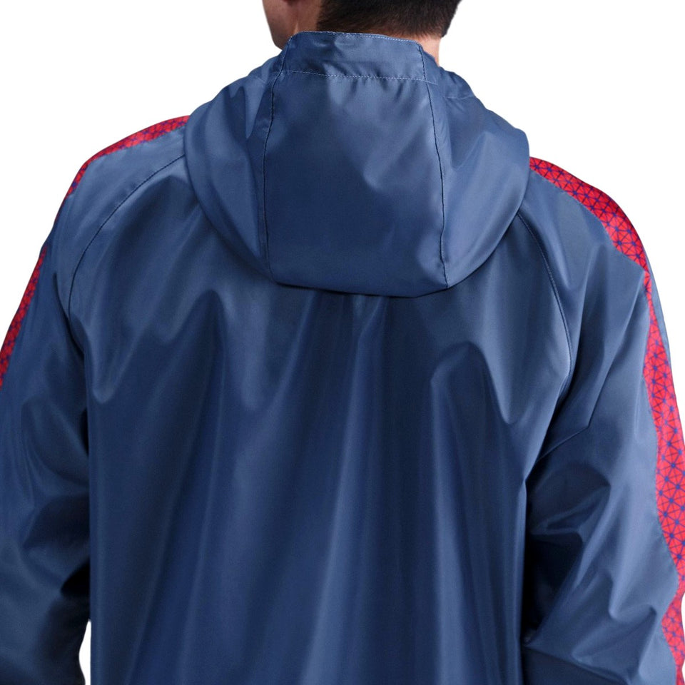 Back view of navy hooded Paris Saint-Germain woven tracksuit men's jacket with red patterned shoulder stripes