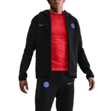 Nike PSG black Tech Fleece tracksuit 2025 26 with zip-up hoodie and matching pants on SoccerTracksuits.com