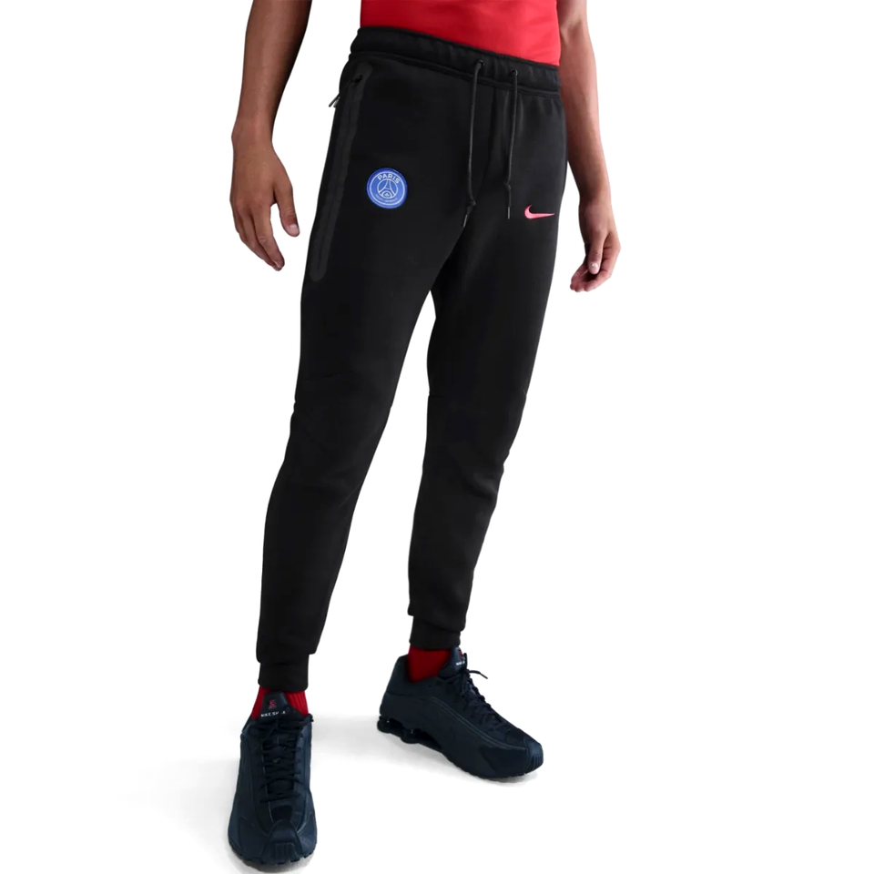 Nike PSG black Tech Fleece tracksuit 2025 26 with slim fit and signature logo on SoccerTracksuits.com