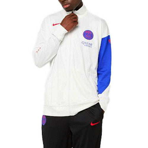 Model wearing white PSG Nike Total 90 tracksuit 2025 26 jacket with blue sleeve and black pants