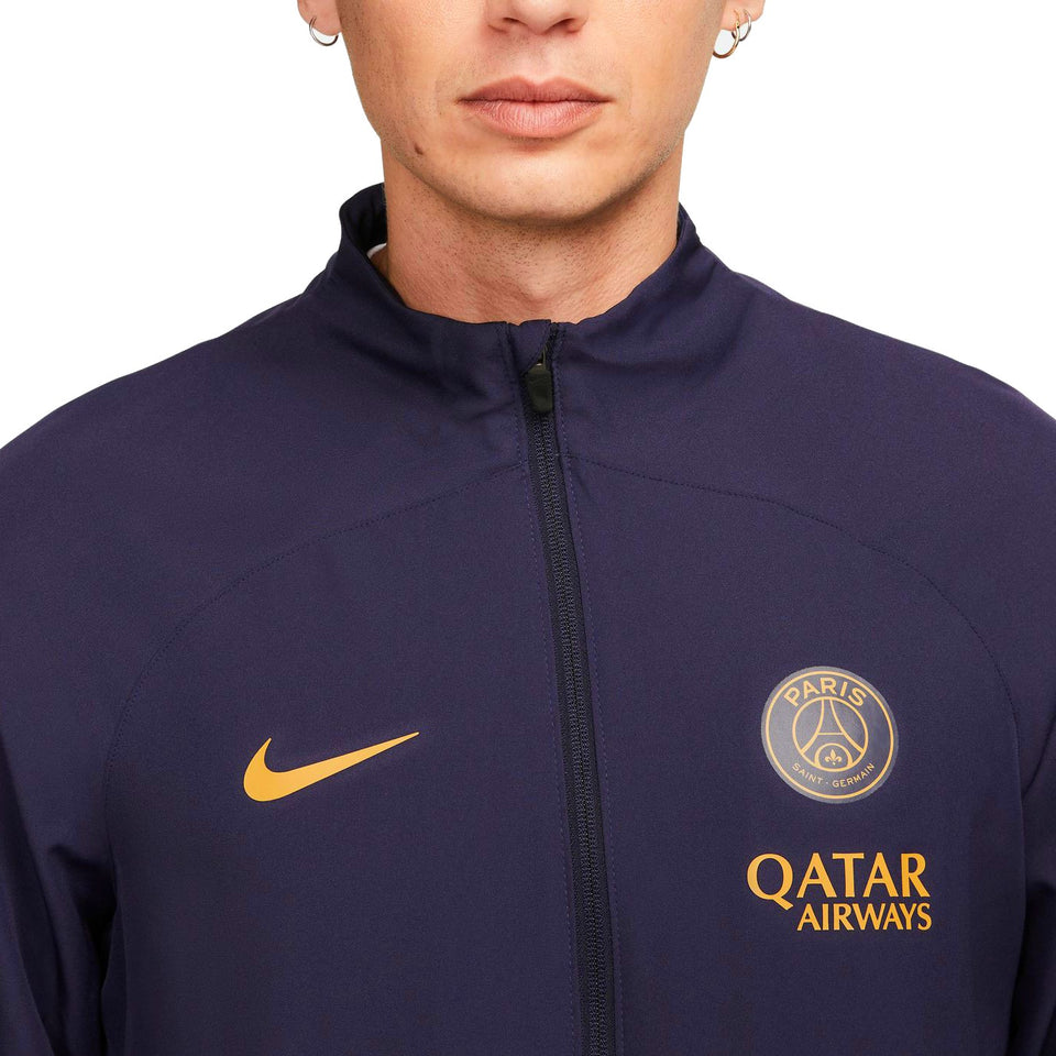 Nike PSG soccer tracksuit for men in navy blue with gold logo and Qatar Airways branding