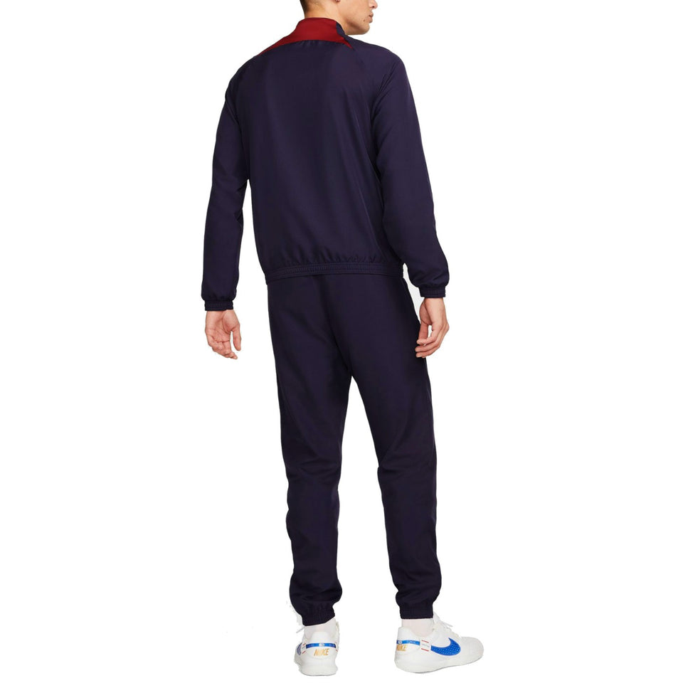Rear view of Nike PSG soccer tracksuit for men in navy with red collar detail