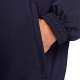 Close-up of navy blue Nike PSG soccer tracksuit for men showing elastic cuff and side pocket