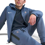 PSG Tech Fleece tracksuit 2025 26 in blue with zippered pockets and hood on SoccerTracksuits.com