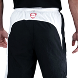 Back view of PSG Total 90 soccer tracksuit pants showing black and white design details