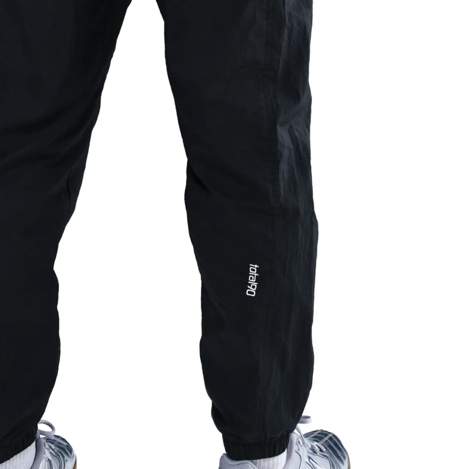 Black PSG Total 90 soccer tracksuit pants with a comfortable fit for active wear