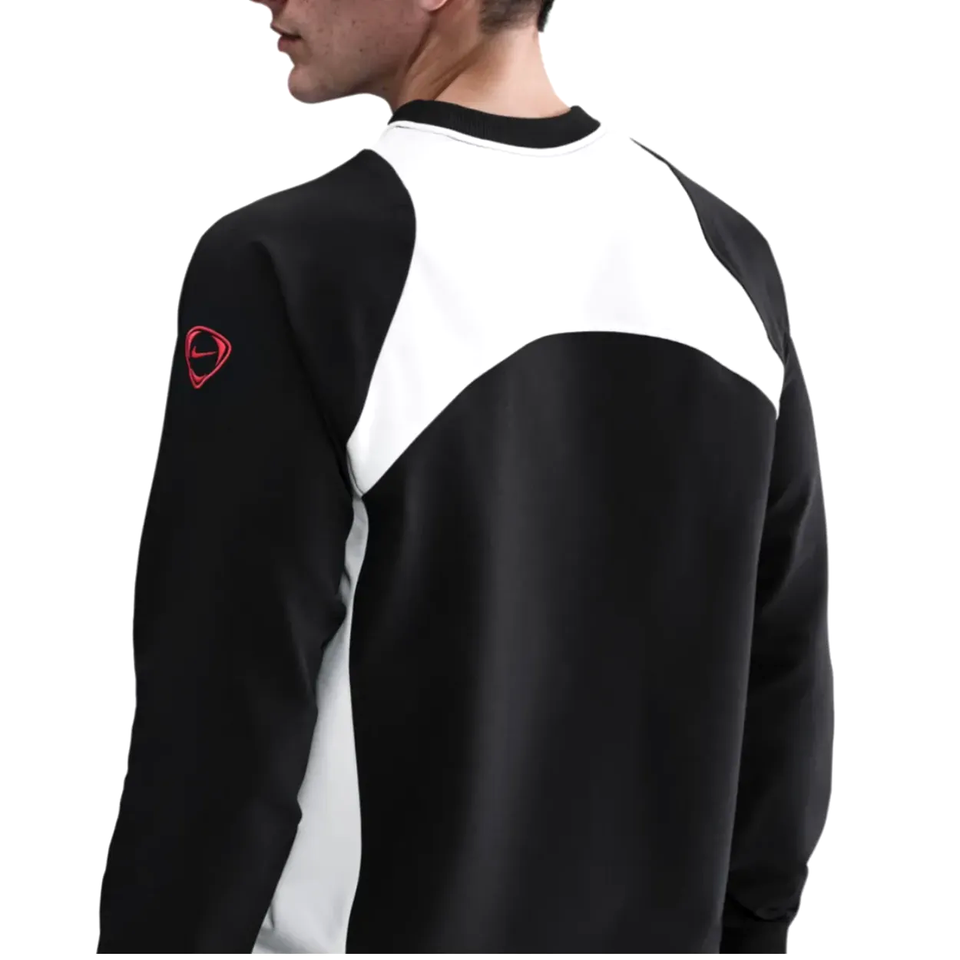 Back view of the PSG Total 90 soccer tracksuit in black and white with a sleek design