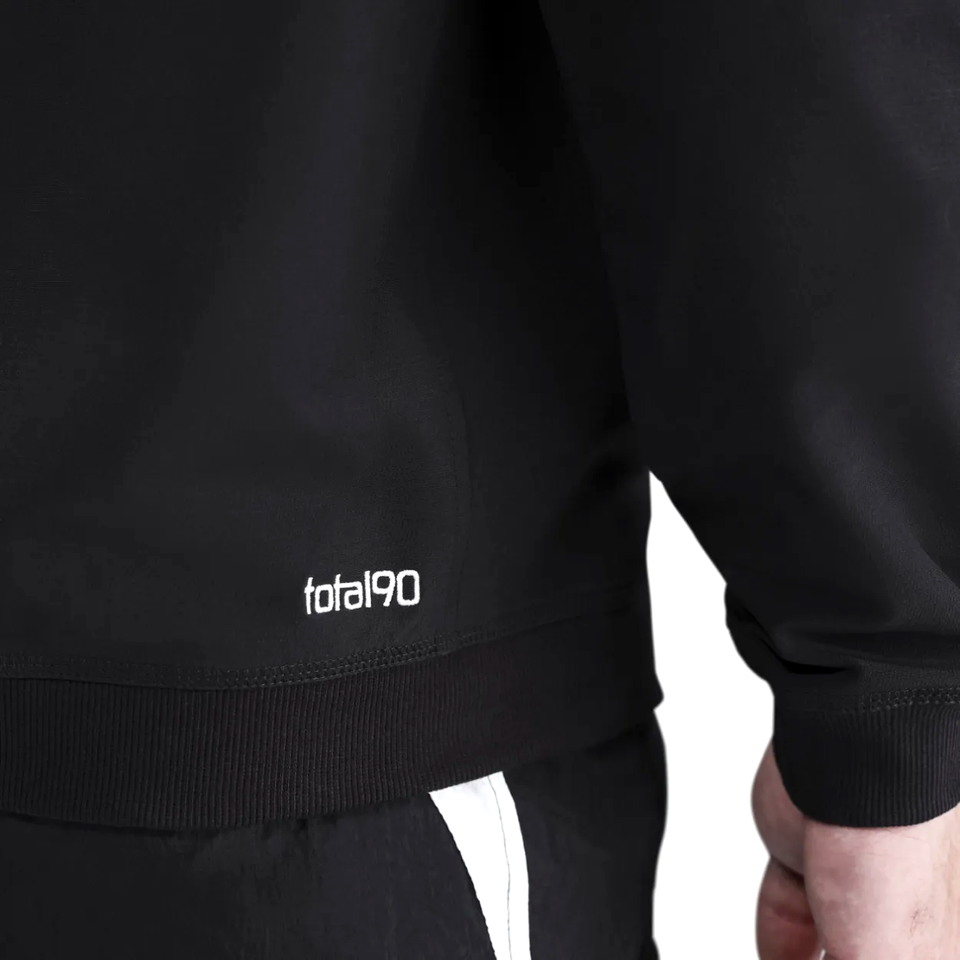 Close-up of the PSG Total 90 soccer tracksuit featuring the Total90 logo on the sleeve