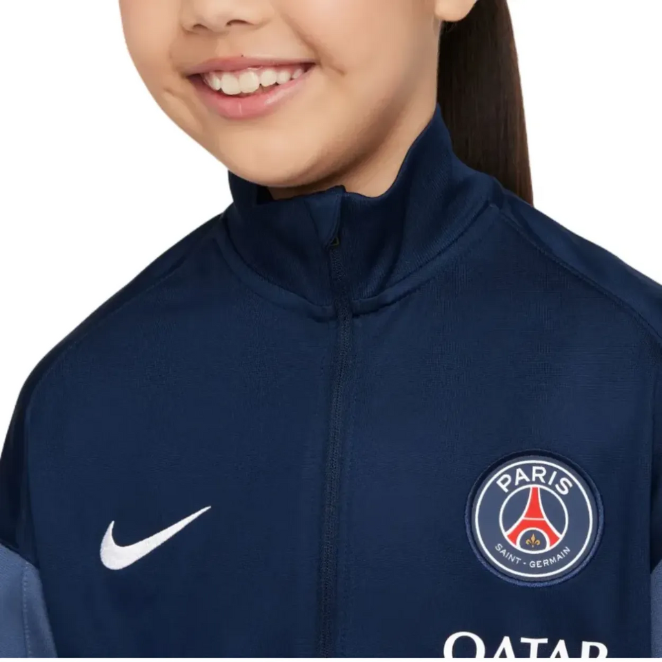 Nike PSG training suit for kids 2025 featuring a blue design and Paris logo for young fans