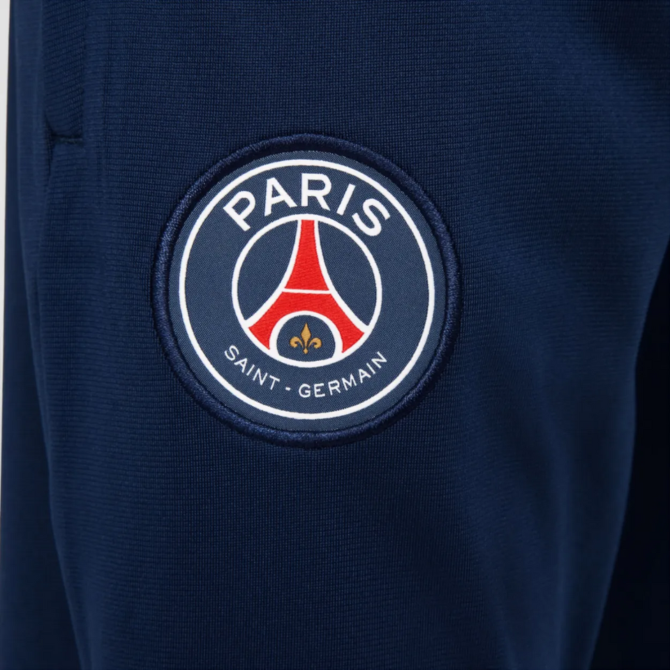 Close-up of Nike PSG training suit for kids 2025 logo featuring the Paris Saint-Germain crest