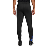 Back view of Nike PSG UCL Total 90 tracksuit pants in black with blue accents for soccer enthusiasts