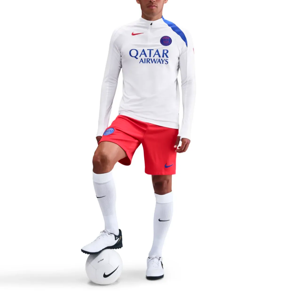 Nike PSG UCL Total 90 tracksuit featuring a white top and red shorts for ultimate comfort and style