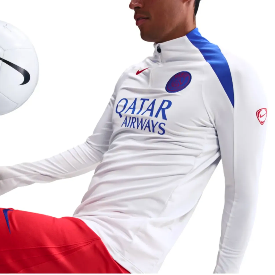 Nike PSG UCL Total 90 tracksuit featuring a red and white design with Qatar Airways logo
