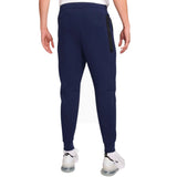Back view of navy jogger pants from Nike tech fleece tracksuit France 2024 with zippered pocket and cuffed ankles