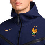 Close-up of Nike tech fleece tracksuit France 2024 navy jacket with France rooster emblem and gold Nike logo