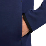 Close-up of navy blue Nike tech fleece tracksuit France 2024 sleeve with black cuff and pocket