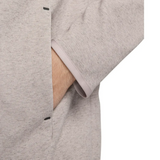 Close-up of the pocket and sleeve detail on the Tottenham Hotspur Tech Fleece tracksuit on SoccerTracksuits.com