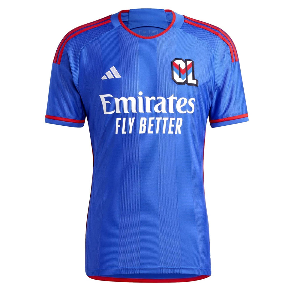 Olympique Lyon away jersey 2023 24 in blue with red accents and Emirates sponsor logo