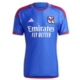 Olympique Lyon away jersey 2023 24 in blue with red accents and Emirates sponsor logo