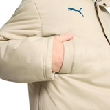 Close-up of Olympique Marseille Puma winter jacket showing a gold color and Puma logo